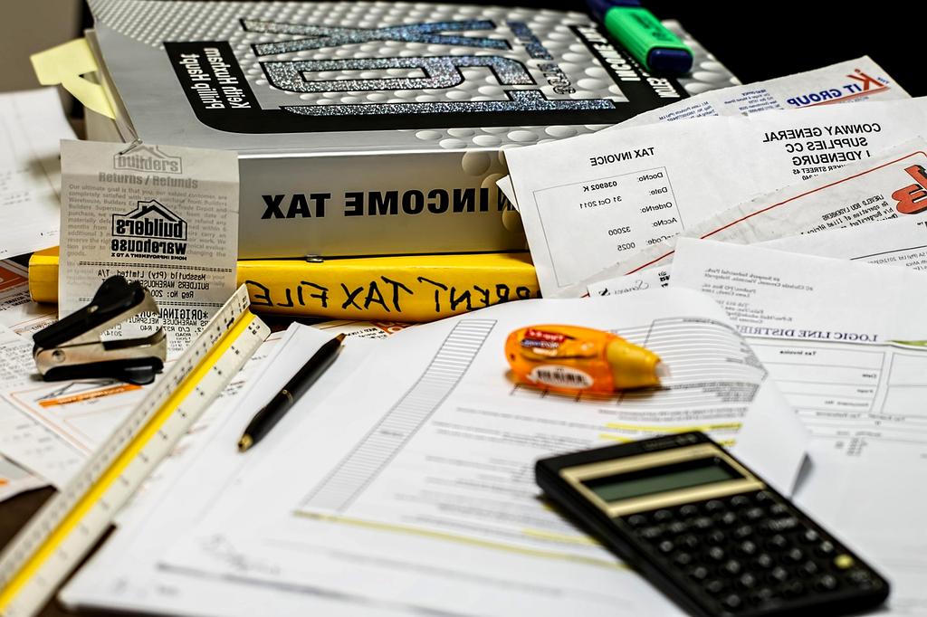 Calculator and pen on financial documents